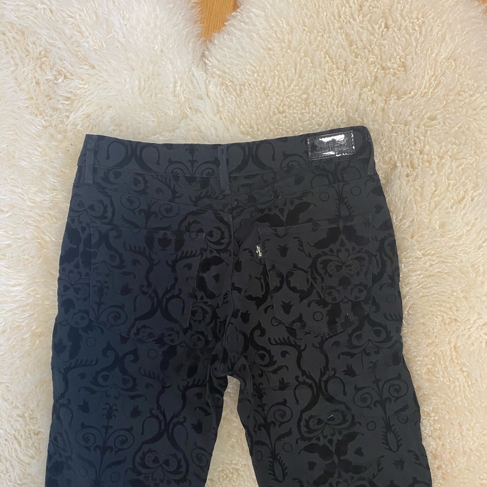 Levi mid-rise black jeans with velvet accents